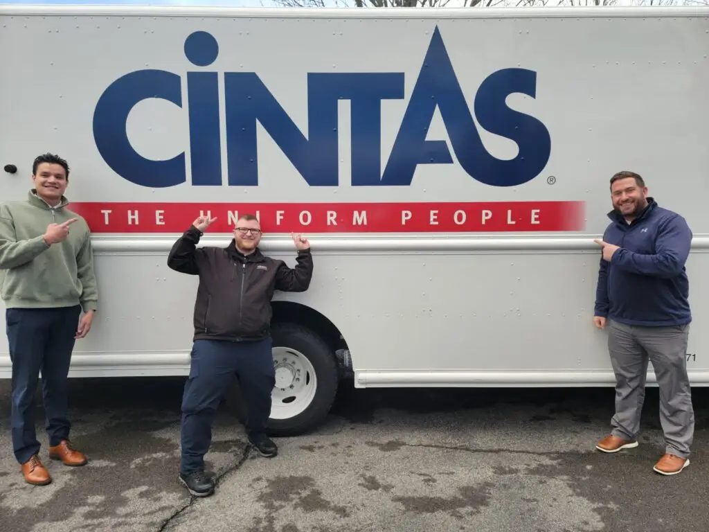 Three men promoting Professional Workwear with Cintas