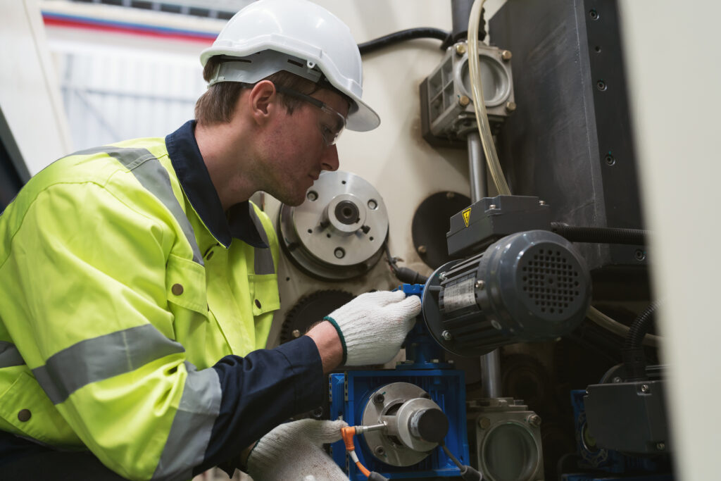 Maintenance Technician work on industrial machinery. 